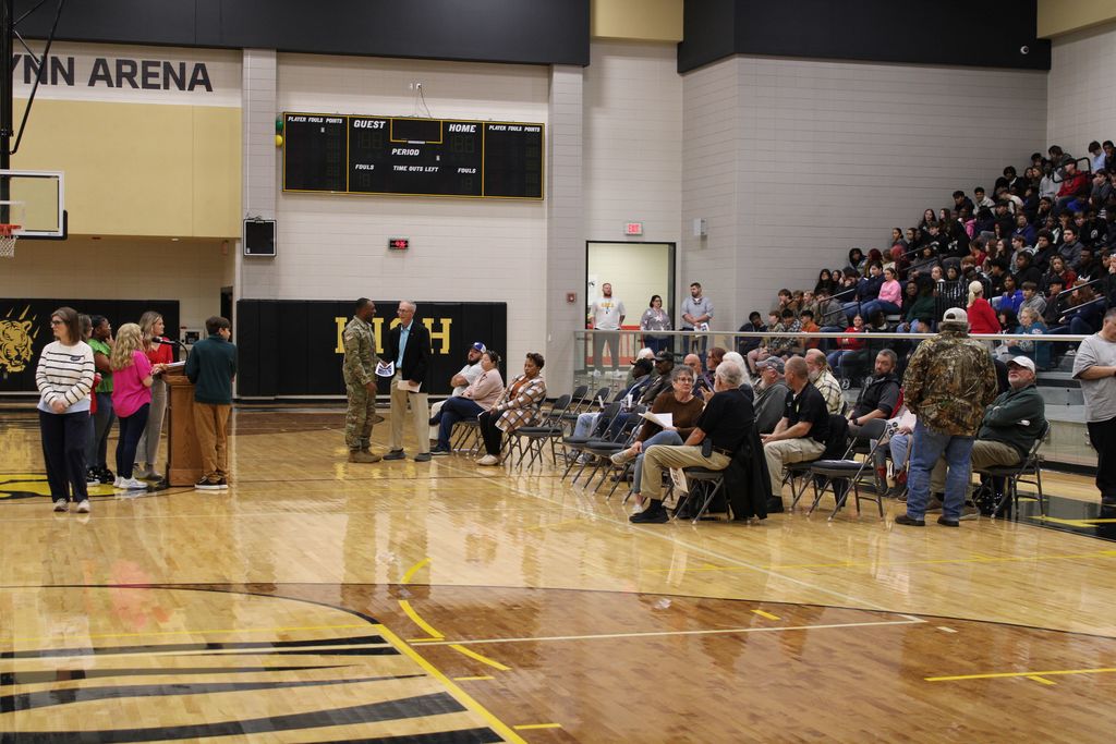 Image showing CHS Honors Our Heroes! A Day of Deep Gratitude 🌟 Claxton High School and the history department hosted a deeply meaningful Veterans Day program Tuesday, November 1, 2025, to honor those who have served. 🏫 The day began bright and early with a special breakfast 🥓☕ for the veterans, a small token of our immense appreciation.  Our guest speaker, 2nd Lt. Jordan Hendrix (Platoon Leader, 3rd ID, Ft. Stewart), delivered a powerful message on selfless service 🛡️, emphasizing that true dedication happens not just on the battlefield but also in the quiet moments of daily life. He encouraged our students to live with purpose and "do what is right, even when no one is watching." 💪  The program featured heartfelt tributes from our talented students (Mila Sapp, Emmie Stanfield, Victor Fuentes, Kaydence Snellgrove, Jordan Brown) and inspiring performances by the CHS Band 🎶🎺 and Chorus 🎤. The ceremony culminated with the band’s moving Salute to Armed Forces, where we proudly recognized the veterans from each service branch present with a big round of applause! 👏  Thank you to all our veterans for your service and sacrifice! 🙏 Your commitment inspires us all. 💖  #CHSVeteransDay #ThankYouVets #SelflessService #ClaxtonHigh #LivingWithPurpose #GAStrong #MilitaryAppreciation #Honor 🦅  Pictures courtesy of Gregory Crosby, Dylan Tidwell, and Glenn Lewis