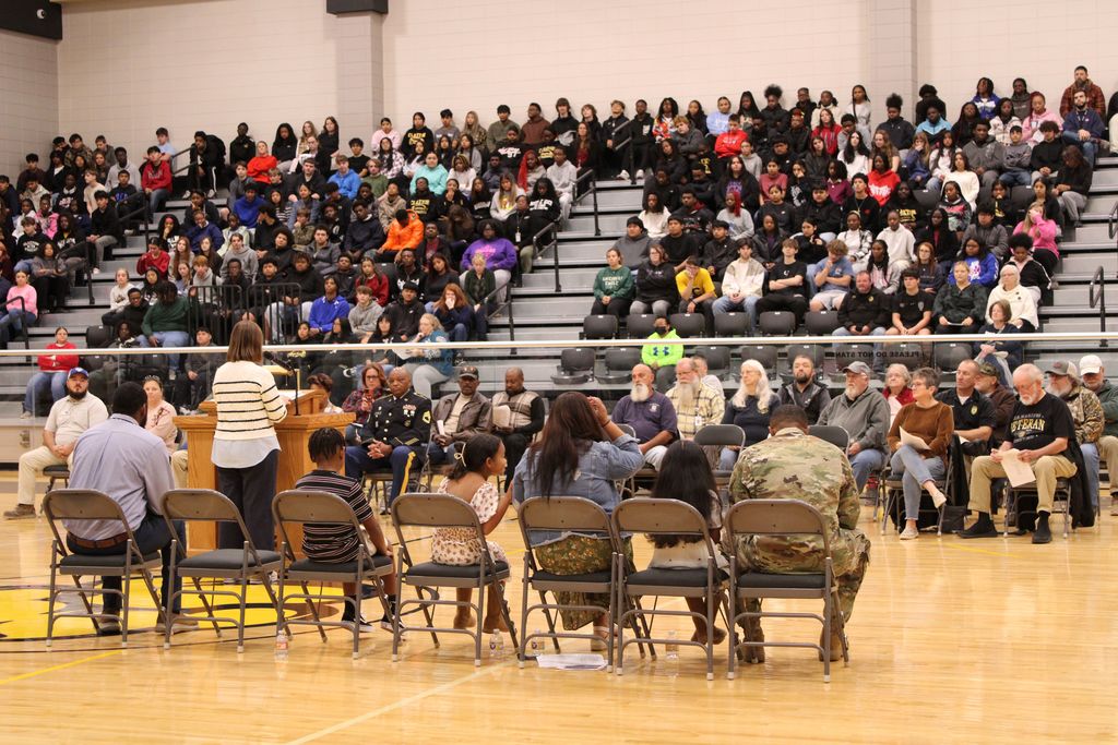 Image showing CHS Honors Our Heroes! A Day of Deep Gratitude 🌟 Claxton High School and the history department hosted a deeply meaningful Veterans Day program Tuesday, November 1, 2025, to honor those who have served. 🏫 The day began bright and early with a special breakfast 🥓☕ for the veterans, a small token of our immense appreciation.  Our guest speaker, 2nd Lt. Jordan Hendrix (Platoon Leader, 3rd ID, Ft. Stewart), delivered a powerful message on selfless service 🛡️, emphasizing that true dedication happens not just on the battlefield but also in the quiet moments of daily life. He encouraged our students to live with purpose and "do what is right, even when no one is watching." 💪  The program featured heartfelt tributes from our talented students (Mila Sapp, Emmie Stanfield, Victor Fuentes, Kaydence Snellgrove, Jordan Brown) and inspiring performances by the CHS Band 🎶🎺 and Chorus 🎤. The ceremony culminated with the band’s moving Salute to Armed Forces, where we proudly recognized the veterans from each service branch present with a big round of applause! 👏  Thank you to all our veterans for your service and sacrifice! 🙏 Your commitment inspires us all. 💖  #CHSVeteransDay #ThankYouVets #SelflessService #ClaxtonHigh #LivingWithPurpose #GAStrong #MilitaryAppreciation #Honor 🦅  Pictures courtesy of Gregory Crosby, Dylan Tidwell, and Glenn Lewis