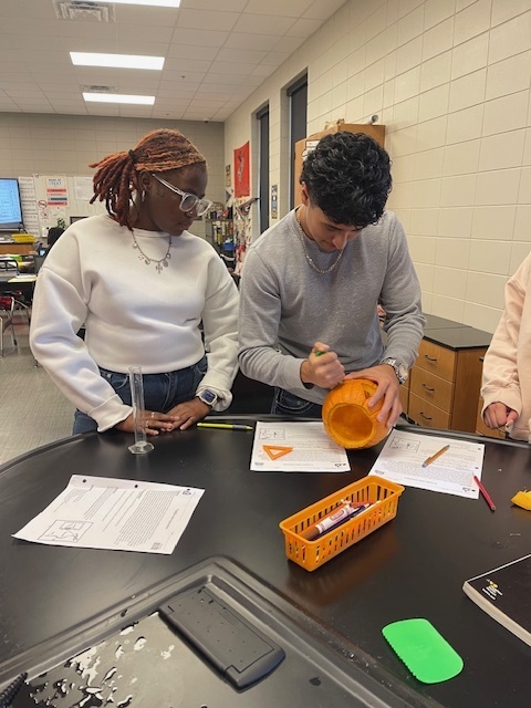 Image showing What's inside a pumpkin? Ask Mrs. Minis' Biology class! 🧠 Students spent time exploring the molecular building blocks of life by performing a hands-on lab to extract DNA from pumpkins. This simple yet powerful experiment helped them visualize DNA strands and reinforce their genetics lessons. After their lab, they enjoyed some fun carving time. Excellent job combining learning and celebration! 🖤🧡 #BiologyLab #DNAExtraction #MinisClass #ScienceEducation