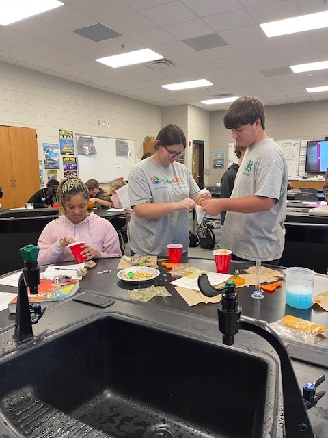 Image showing What's inside a pumpkin? Ask Mrs. Minis' Biology class! 🧠 Students spent time exploring the molecular building blocks of life by performing a hands-on lab to extract DNA from pumpkins. This simple yet powerful experiment helped them visualize DNA strands and reinforce their genetics lessons. After their lab, they enjoyed some fun carving time. Excellent job combining learning and celebration! 🖤🧡 #BiologyLab #DNAExtraction #MinisClass #ScienceEducation