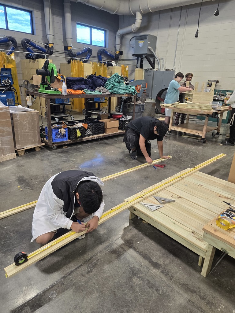 Image showing 🎄 Ag Mech Students Building Holiday Cheer! 🚂 Mr. Turner's Ag Mech 1 class students are hard at work, applying their skills to build a special wooden train for Christmas!  This project is a great way for students to master essential skills, including woodworking techniques, effective communication for collaboration, and the importance of using proper PPE (Personal Protective Equipment) to ensure safety.  Great job blending craftsmanship with holiday spirit! 🖤💛  #TheDEN #AgMech1 #Woodworking #CTAE #ShopClass #ChristmasProject #SafetyFirst 🛠️