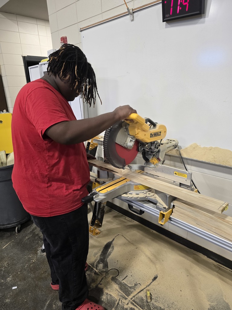 Image showing 🎄 Ag Mech Students Building Holiday Cheer! 🚂 Mr. Turner's Ag Mech 1 class students are hard at work, applying their skills to build a special wooden train for Christmas!  This project is a great way for students to master essential skills, including woodworking techniques, effective communication for collaboration, and the importance of using proper PPE (Personal Protective Equipment) to ensure safety.  Great job blending craftsmanship with holiday spirit! 🖤💛  #TheDEN #AgMech1 #Woodworking #CTAE #ShopClass #ChristmasProject #SafetyFirst 🛠️