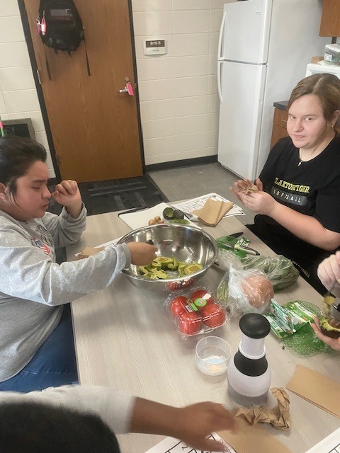 Image showing Guacamole, Cupcakes, and Great Teamwork! 🥑🧁  The CHS peer group had a busy and productive day in the kitchen! The group worked together to prepare a student-selected menu of fresh guacamole and delicious cupcakes.  While the food was fantastic, the real focus was on mastering the "ingredients" of a successful team. Students practiced:  Clear Communication: Keeping everyone on the same page.  Mutual Support: Helping teammates cross the finish line.  Organization: Maintaining a tidy and efficient workspace.  By staying organized and supporting one another, our students ensured a smooth and efficient food prep process. Great job to all our student chefs! 🖤💛  #LifeSkills #Teamwork #KitchenSkills #StudentSelected #TigerPride