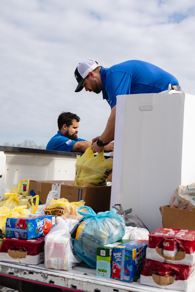 Ogeechee HVAC unloading food donation for SCA.