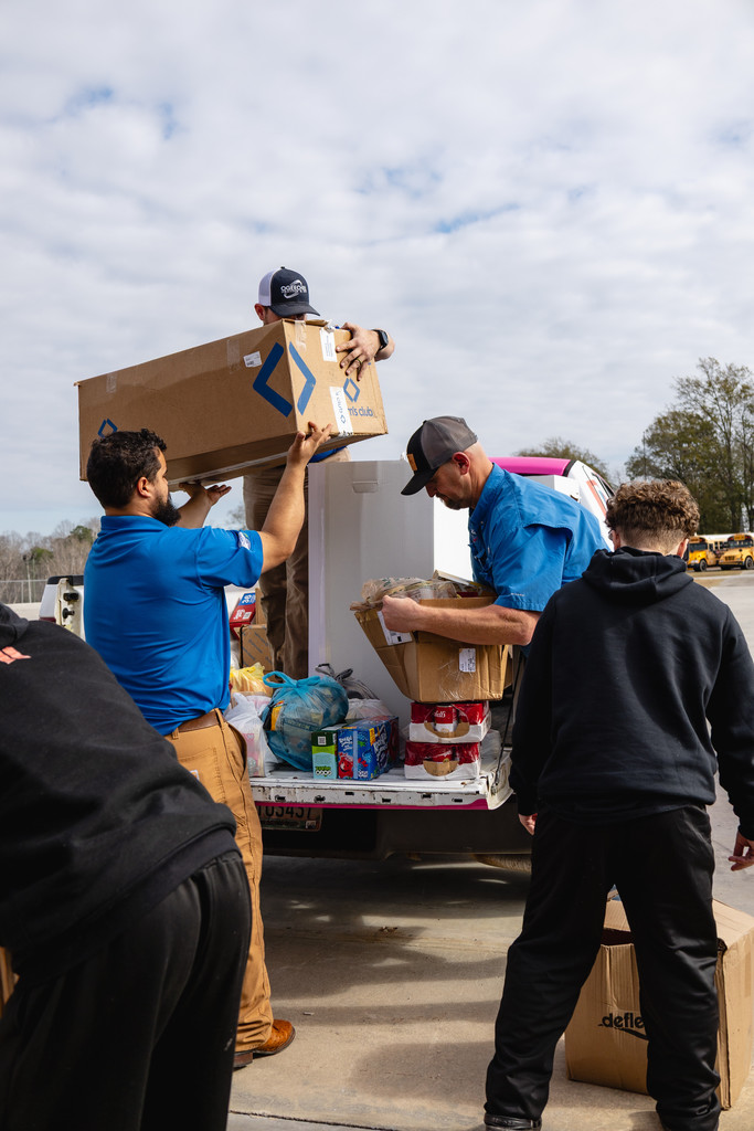 Ogeechee HVAC unloading food donation for SCA.