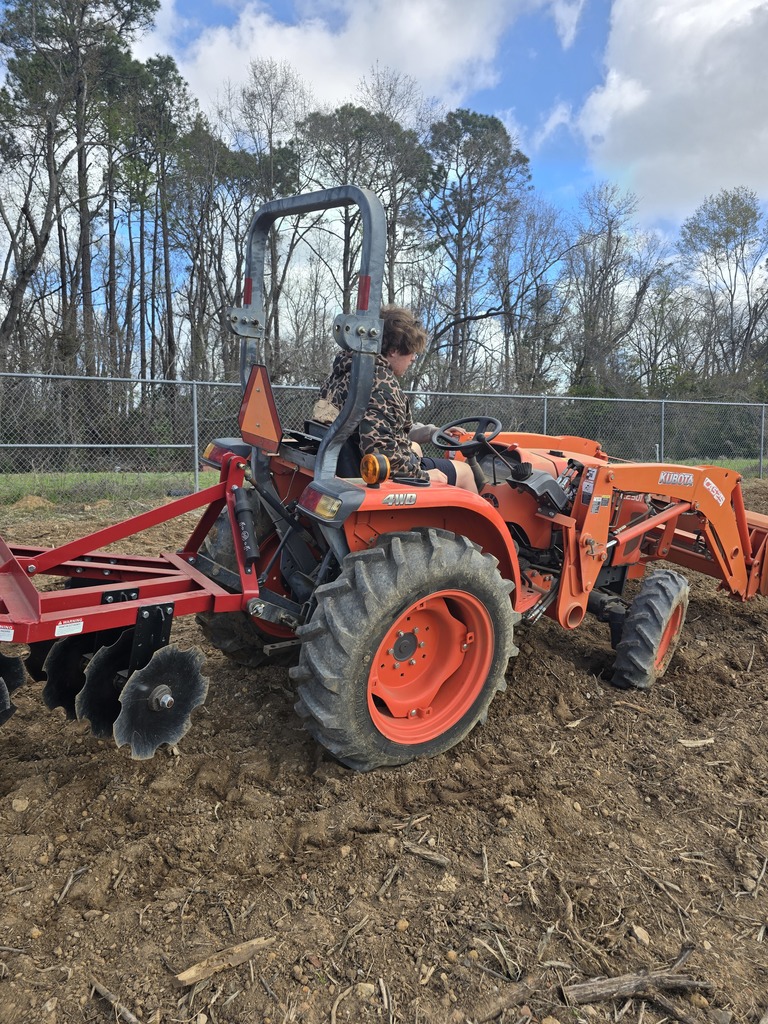 Image showing 🚜 Breaking Ground: Ag Mech 2 is Heading to the Field! 🌱  Spring is just around the corner, and our Ag Mechanics 2 students are making sure The DEN is ready! This week, students moved from the classroom to the tractor seat to begin prepping the soil for our springtime grass planting.  This hands-on lesson focused on the mastery of the three-point harrow. Operating a tractor while pulling an implement requires a high level of coordination and a "safety-first" mindset. Our Tigers aren't just driving; they are learning the technical side of agriculture, including:  Safe Operating Procedures: Mastering the "rules of the road" for agricultural machinery.  Hitch Mastery: Identifying tractor parts and the complex mechanics of attaching and removing implements.  Precision Prep: Using the harrow to break ground effectively for optimal planting conditions.  We are proud to see our students applying their classroom knowledge to real-world tasks! 🐯🖤💛  #TheDEN #AgMechanics #HandsOnLearning #FutureFarmers #TractorSafety #ClaxtonHigh