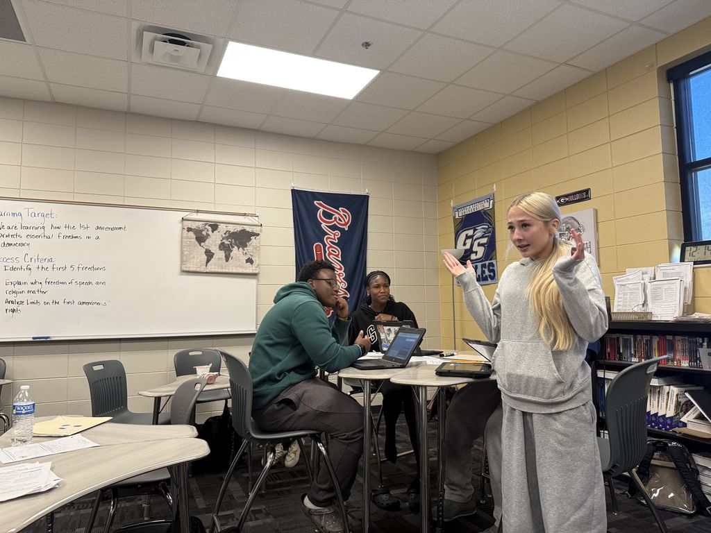 Image showing ⚖️ Order in the Court: Coach Lanier’s Class Takes on the Supreme Court! 🏛️ What happens when a peaceful protest turns chaotic, and a student is suspended without a chance to tell her side of the story? That was the high-stakes scenario facing Coach Lanier’s students recently! After studying Civil Rights, Civil Liberties, and Due Process, our Tigers put their knowledge to the test using an interactive iCivics court simulation. The case centered on a student’s right to a fair process and whether her school overstepped when they suspended her for carrying a protest sign. The Courtroom Roles: The Defense: Arguing for the school’s right to maintain order. The Plaintiff: Fighting for the student's right to due process and free speech. The Supreme Court Justices: Reviewing the arguments and making the final ruling. This simulation was a powerful way to bridge the gap between our current unit and the Judicial Branch, showing exactly how the Supreme Court functions as an appellate court. Our students did an incredible job researching their positions and preparing for "heated" counter-arguments! 🐯🖤💛 #CivicsInAction #iCivics #DueProcess #SupremeCourt #FutureLawyers #TigerPride