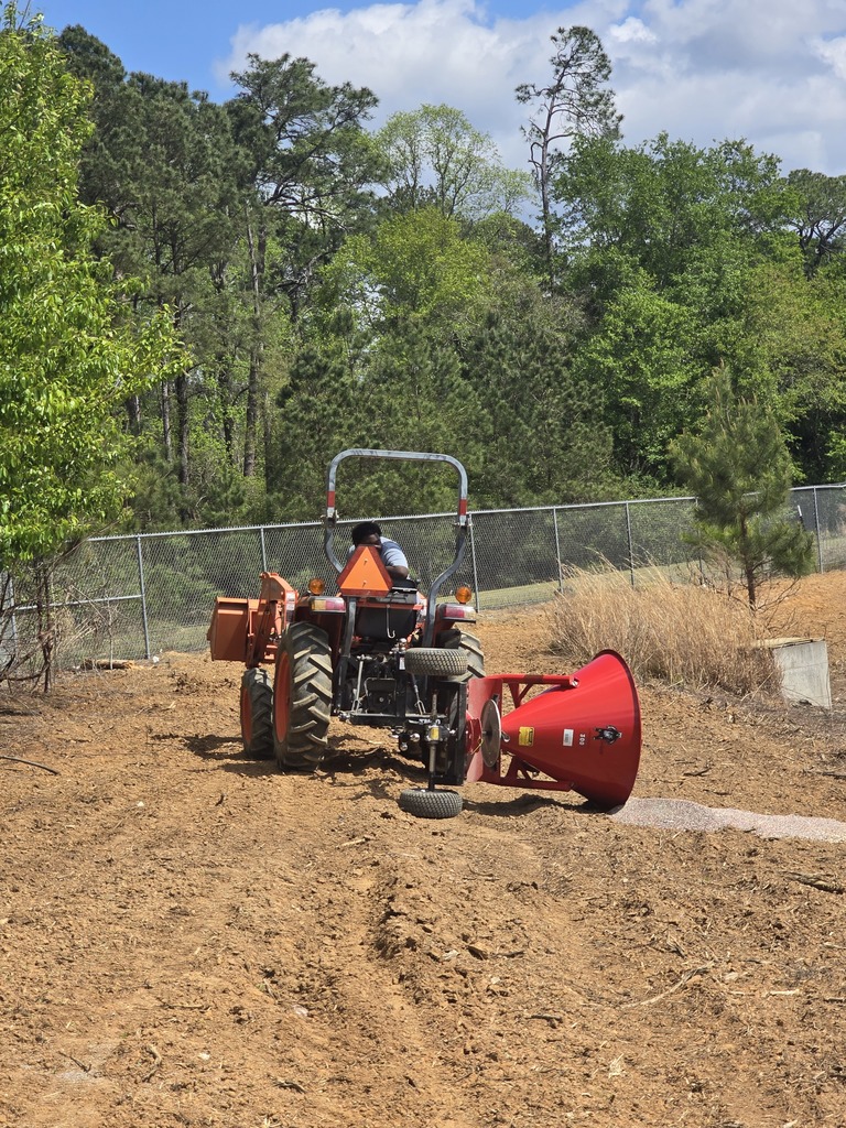 Image showing 🌱 Real-World Lessons in the Garden: Watch Your Step! 🚜 In Mr. Turner’s Horticulture class, we know that the best learning happens outside the four walls of a classroom. Recently, our students were busy spreading seed to get the campus ready for spring—but they picked up a very important lesson in physics along the way! The takeaway: When you’re operating a spreader, you have to keep your eyes on the ground. One hidden hole or a bit of uneven turf is all it takes to flip your equipment and send your seed flying! Don't worry! The seeds were salvaged after the mishap. Ag education is all about trial, error, and adjustment. Our Tigers dusted themselves off, leveled out their path, and got back to work. Experience is the best teacher! 🐯🖤💛 #TheDEN #Horticulture #LearningByDoing #AgLife #WatchTheHoles #TigerPride