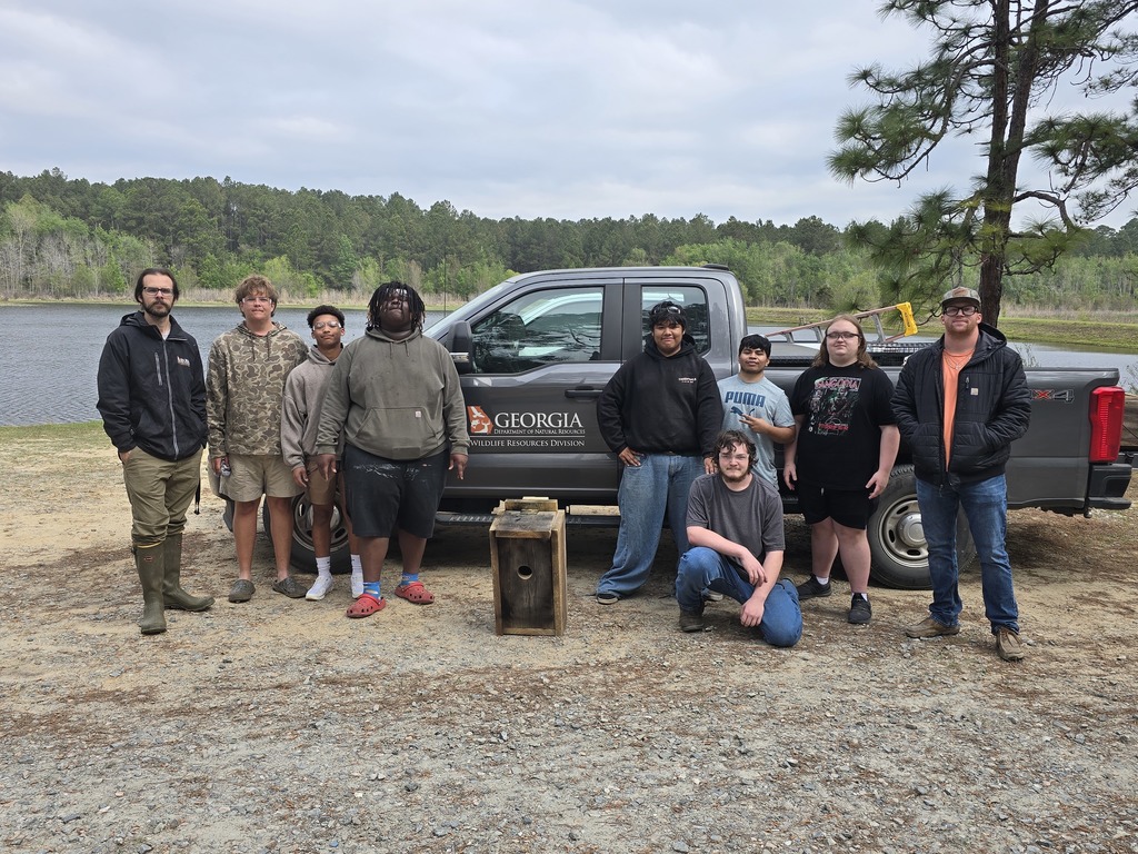 Image showing 🦆 New Five-Star Accommodations at the PFA: Ag Mechanics Builds Duck Boxes! 🪵 Our Ag Mechanics students are officially helping the local wildlife move into some prime real estate! The class completed and personally installed custom-built duck boxes at the Evans County Public Fishing Area (PFA). The students had the privilege of working alongside Caleb Mills, a Wildlife Technician at the PFA, to learn exactly where and how these boxes should be placed to best support local nesting waterfowl. This project was the perfect blend of classroom skill and environmental stewardship. What the Tigers Accomplished: Precision Woodworking: Building durable, weather-resistant duck boxes designed for the elements. Wood Preservation: Applying techniques to ensure the structures last for many seasons to come. Field Installation: Getting hands-on experience in the habitat, ensuring the boxes were securely and correctly positioned. Seeing their hard work move from the shop to the water was a proud moment for these students. A huge Thank You to Caleb Mills and the Evans County PFA team for letting our Tigers play a part in local conservation! 🐯🖤💛 #TheDEN #AgMechanics #DuckBoxes #WildlifeConservation #EvansCountyPFA #HandsOnLearning