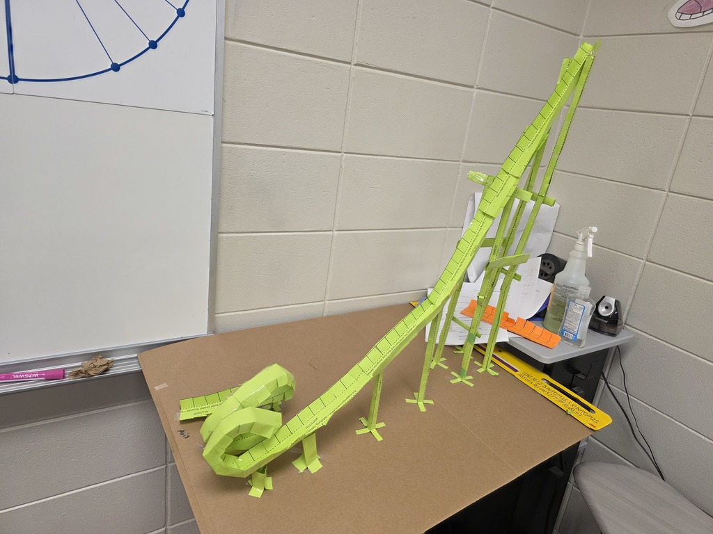 Image showing 📐 Engineering Excellence: Polynomials at Work 💻  In Mr. Transue’s Advanced Algebra class, students are learning that polynomials are the building blocks of the world around us—including our favorite theme park rides!  To successfully complete their roller coaster project, students had to use graphing technology to create a "blueprint" of their track. They analyzed the peaks, valleys, and intercepts of their functions to predict how a marble would travel. The true test came during construction, where they had to account for real-world variables like friction and gravity.  Whether they were tackling the Vertical Loop or ensuring a marble survived a high-speed valley, these Tigers proved that they have the grit and the mathematical mind to solve complex engineering problems.  #MathSkills #FutureEngineers #AdvancedAlgebra #DesmosMath #TigerPride