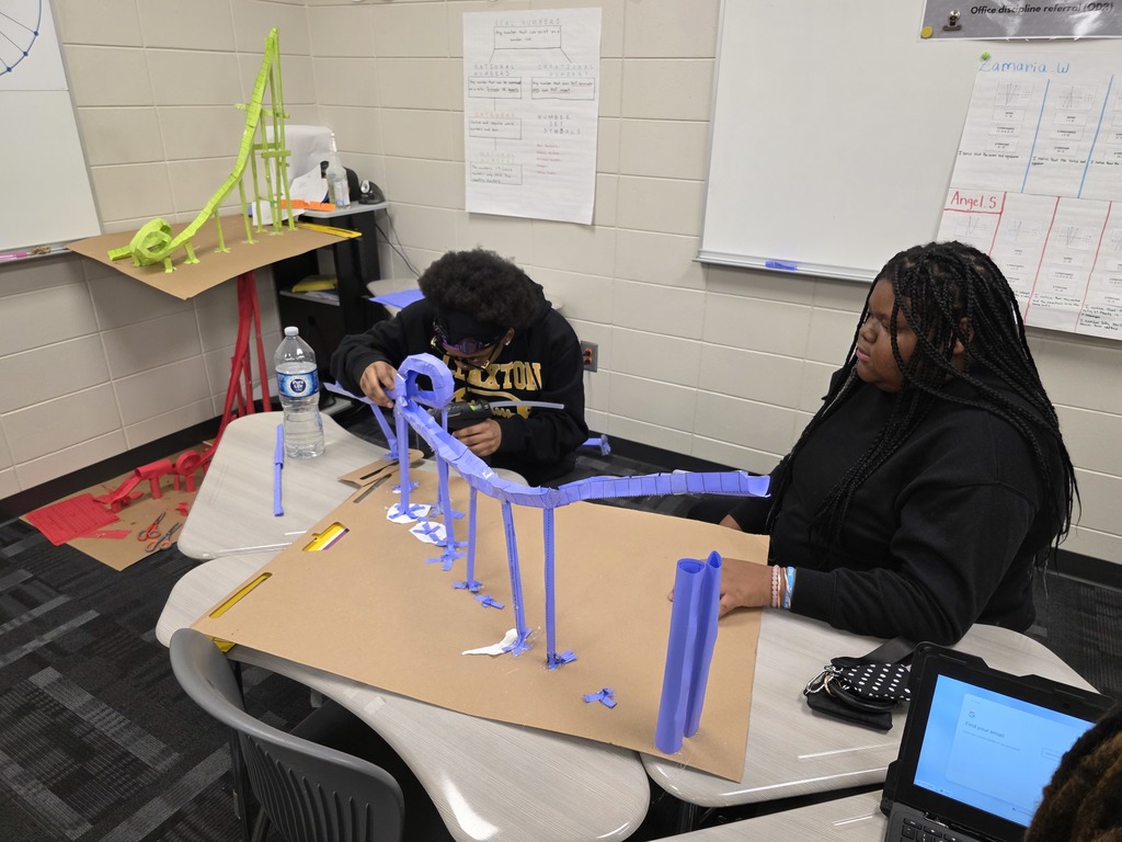 Image showing 📐 Engineering Excellence: Polynomials at Work 💻  In Mr. Transue’s Advanced Algebra class, students are learning that polynomials are the building blocks of the world around us—including our favorite theme park rides!  To successfully complete their roller coaster project, students had to use graphing technology to create a "blueprint" of their track. They analyzed the peaks, valleys, and intercepts of their functions to predict how a marble would travel. The true test came during construction, where they had to account for real-world variables like friction and gravity.  Whether they were tackling the Vertical Loop or ensuring a marble survived a high-speed valley, these Tigers proved that they have the grit and the mathematical mind to solve complex engineering problems.  #MathSkills #FutureEngineers #AdvancedAlgebra #DesmosMath #TigerPride