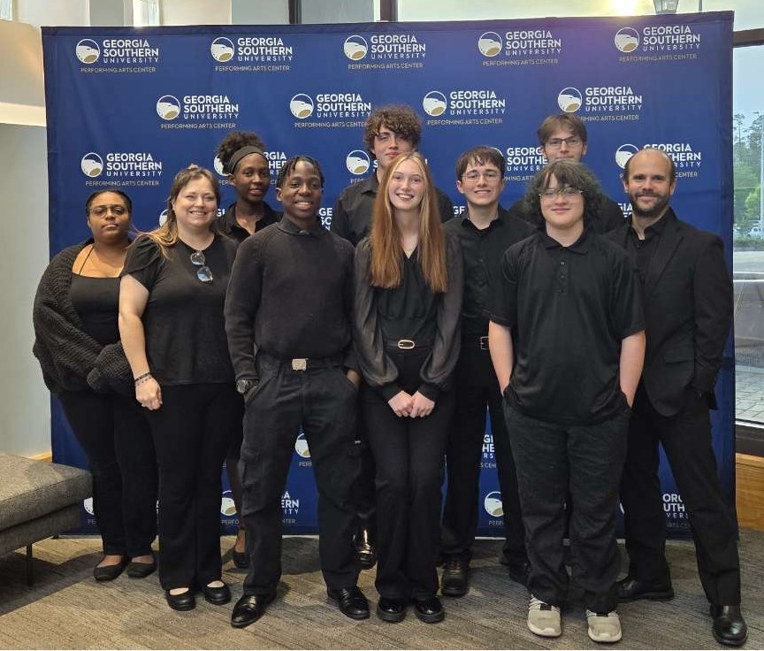 Image showing 🎺 From Claxton to the Big Stage: CHS Students, Staff, and other Claxton Residents Join GSU Community Band! 🎶  Music doesn’t end at graduation, and our Tigers proved that this past Tuesday night! On April 28th, current and former Claxton High School students, parents, and teachers took the stage at Georgia Southern University to perform with the GSU Community Band.  This unique ensemble brings together high schoolers, college students, parents, and band directors from across the region, creating a rich environment for mentorship and musical growth.  Reflections from the Stage:  "I enjoy having the opportunity to perform alongside GSU’s Community Band. It allows me to continue learning from the professors at Georgia Southern while also continuing to make music. It also gives students the chance to see me as a performer and me the opportunity to play alongside them." — Alfredo Maruri, CHS Band Director  "Performing with the GSU community band is always an uplifting and beautiful experience. Last night's performance was definitely something to be proud of. It is such a great experience to be able to play with people of all ages and abilities." — Rachel Wilkie, Class of 2026  Congratulations to all our performers for representing Claxton with such talent and passion. 🐯🖤💛  #TigerBand #GSUCommunityBand #MusicEducation #LifelongLearning #TigerPride