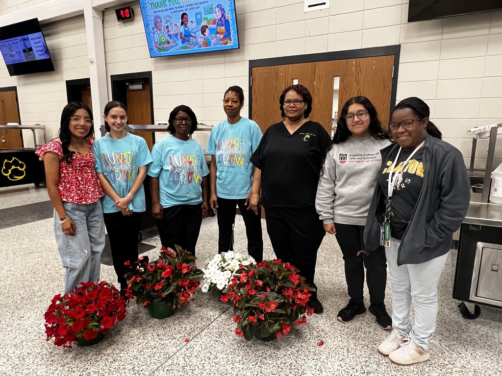 Image showing 👩‍🍳 Celebrating the Heart of the Cafeteria 🥗  At Evans County Schools, we know that success in the classroom starts with a good meal. Today, we honored the dedicated professionals who make that possible: our School Lunch Heroes.  Staff and students from both Claxton Middle and Claxton High spent time today expressing their thanks to our cafeteria team. These ladies are the backbone of our daily routine, and we were thrilled to surprise them with hanging baskets, cards, and some posters to brighten their day.  Thank you for your dedication, your hard work, and for keeping our Tiger family well-nourished. You are truly appreciated! 🐯💐  #SchoolNutrition #SchoolLunchHero #CommunityAppreciation #EvansCountySchools