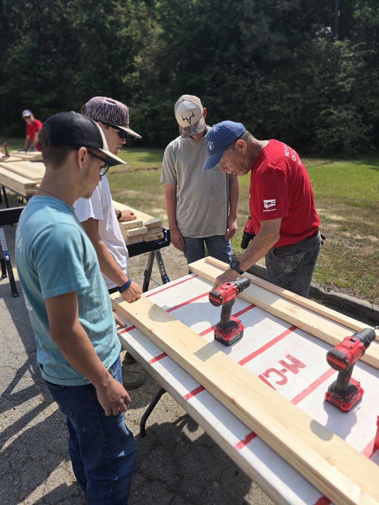 Image showing 🛏️ No Kid Sleeps on the Floor: Claxton FFA Makes an Impact in Macon! 🐯  Our Claxton FFA Chapter recently returned from a powerful five-day journey at the Georgia FFA State Convention in Macon. While the week was filled with leadership workshops and exploration, the highlight was a massive community service initiative that hit close to home.  In partnership with Sleep in Heavenly Peace, our very own Preston Waters, Mason Sapp, and Garrison Sapp joined forces with FFA members from across Georgia to build over 1,000 beds for children in need.  The Mission in Action:  Precision & Skill: Students measured, cut, and sanded lumber to create high-quality bed frames.  Teamwork: Working alongside peers from all over the state to meet an ambitious production goal.  Heart: Knowing that their hard work ensures a child in Georgia won't have to sleep on the floor tonight.  We are incredibly proud of these young men for representing Evans County with such grit and compassion. They didn't just attend a convention; they built a legacy! 🖤💛  #TheDEN #GeorgiaFFA #StateConvention #SleepInHeavenlyPeace #ServiceAboveSelf #ClaxtonFFA
