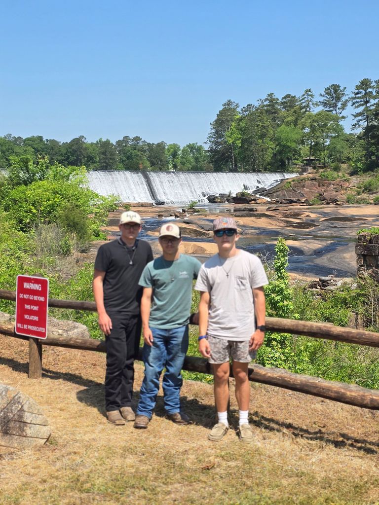 Image showing 🌟 From Service to Scenery: The Claxton FFA State Convention Highlights! 🐯  Our Claxton FFA Chapter attended a transformative five-day experience at the Georgia FFA State Convention in Macon, and "meaningful impact" doesn't even begin to describe it!  Our delegation—Preston Waters, Mason Sapp, and Garrison Sapp—represented Evans County with excellence through a week of hard work and growth.  Here’s a look at their journey:  🛠️ Service with a Heart: Alongside peers from across Georgia, our Tigers helped construct over 1,000 beds for Sleep in Heavenly Peace, ensuring no child in Georgia has to sleep on the floor. (More on this will be share in another post.)  🌲 Outdoor Exploration: To decompress after their hard work, the group headed to High Falls State Park. They traded the convention floor for hiking trails and lake views, appreciating the environmental beauty that is so central to the FFA mission.  📈 Leadership & Networking: Between sessions, students participated in intensive leadership development, sharpening their communication and critical thinking skills while making lifelong friends from every corner of the state.  A huge "Thank You" to Mr. Turner for his unwavering guidance and for helping our Tigers step out of their comfort zones to become more confident, compassionate leaders. 🖤💛  #TheDEN #GeorgiaFFA #StateConvention #ServiceAboveSelf #HighFallsStatePark #FutureLeaders
