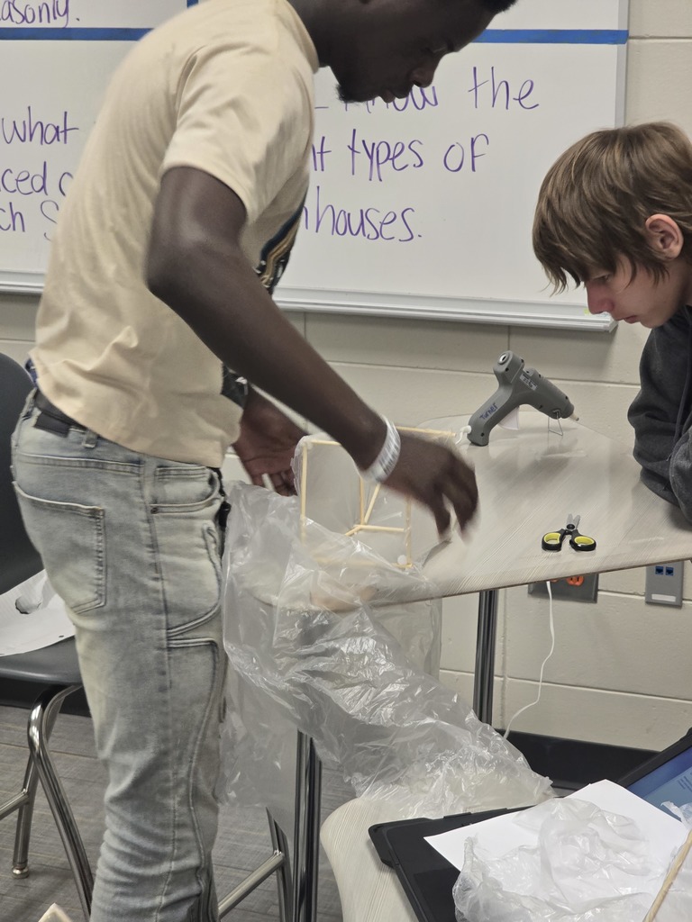 Image shows Mini Greenhouses, Major Skills! 🏗️🌱✨  Mr. Turner’s Horticulture students just leveled up! After studying different structural designs, they went hands-on to build their own mini greenhouses. 🔨  From frame design to climate control, these Tigers are learning exactly what it takes to keep a crop thriving. 🌡️🌿   #TheDEN #Horticulture #MiniGreenhouse #AgKids #ClaxtonHighSchool #HandsOnAg