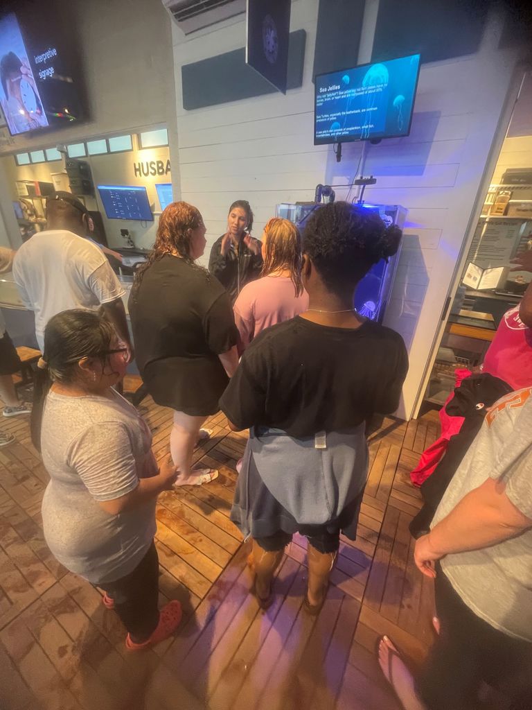 Image showing 🐚 Science, Sand, and Spectacular Memories 🐚  Who says learning only happens indoors? On Friday, May 1,  2026, students from the class of Ms. Johnson, Ms. McNeal, and Ms. Martin headed to Tybee Island for a deep dive into marine biology!  From sifting through the sand to find shore-dwelling creatures to exploring the galleries at the Marine Science Center, our students were true explorers. They didn't just read about the ecosystem—they felt the sand, smelled the salt air, and saw the wildlife firsthand.  Despite the rain during the beach portion of the trip, the smiles stayed bright. It was a day filled with discovery, teamwork, and the kind of memories that last a lifetime. Way to go, Tigers! 🐯🌊  #ClaxtonHigh #MarineBiology #TybeeIslandMSC #FieldTripFun #HandsOnScience