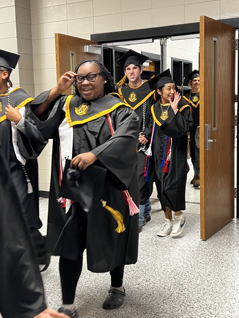 Image showing 🎓 One Last Walk, A Lifetime of Memories: The Class of 2026 Hall Walk 🎓  Today, Friday, May 15, 2026, the hallways of Evans County Schools were filled with a special kind of magic. Our seniors donned their graduation regalia and took their final walk through the schools that helped shape them into the young men and women they are today.  As they marched through the halls, they weren't just walking for themselves—they were walking for the elementary students who gave them high-fives and the middle schoolers who looked up with wide eyes. This tradition serves as a powerful reminder of what hard work and perseverance look like.  Why the Hall Walk matters:  Inspiring the Next Generation: Younger Tigers get to see exactly what their goal is.  A "Thank You" to Teachers: It’s a chance for former teachers to see how much their "little ones" have grown.  The Final Countdown: Tomorrow, these same students will cross Veterans Memorial Field as graduates!  Congratulations to the Class of 2026. You’ve left your mark on these halls, and we can’t wait to see you lead the way tomorrow! 🐯🖤💛  #TheDEN #ClassOf2026 #SeniorHallWalk #TigerLegacy #FullCircle #GraduationEve