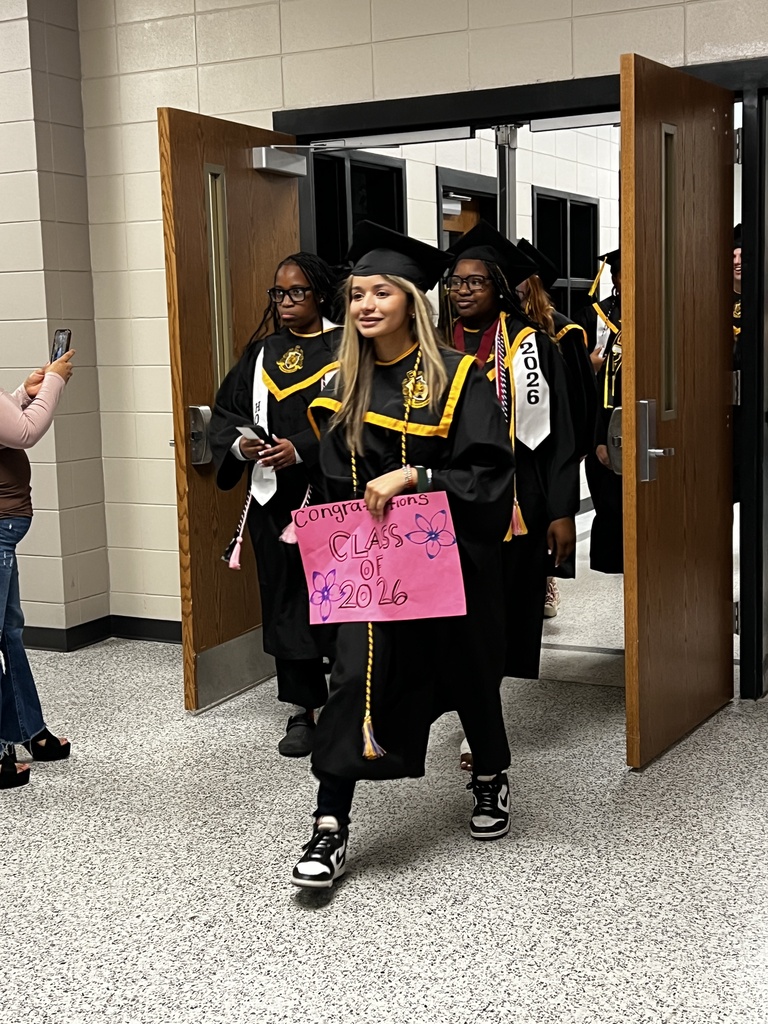 Image showing 🎓 One Last Walk, A Lifetime of Memories: The Class of 2026 Hall Walk 🎓  Today, Friday, May 15, 2026, the hallways of Evans County Schools were filled with a special kind of magic. Our seniors donned their graduation regalia and took their final walk through the schools that helped shape them into the young men and women they are today.  As they marched through the halls, they weren't just walking for themselves—they were walking for the elementary students who gave them high-fives and the middle schoolers who looked up with wide eyes. This tradition serves as a powerful reminder of what hard work and perseverance look like.  Why the Hall Walk matters:  Inspiring the Next Generation: Younger Tigers get to see exactly what their goal is.  A "Thank You" to Teachers: It’s a chance for former teachers to see how much their "little ones" have grown.  The Final Countdown: Tomorrow, these same students will cross Veterans Memorial Field as graduates!  Congratulations to the Class of 2026. You’ve left your mark on these halls, and we can’t wait to see you lead the way tomorrow! 🐯🖤💛  #TheDEN #ClassOf2026 #SeniorHallWalk #TigerLegacy #FullCircle #GraduationEve