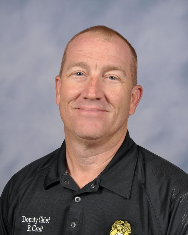 Image showing 🚒Congratulations Instructor Brian Croft! 🏆 Claxton High School and The DEN are incredibly proud to send a massive congratulations to our firefighting instructor and Evans County Fire and Rescue Deputy Chief, Brian Croft! Deputy Chief Croft was recently awarded the prestigious Georgia Chief Fire Officer Certification at the Georgia Association of Fire Chiefs Leadership Conference in Savannah, GA. This certification represents the highest level of professional management and leadership excellence in the fire service. Sharing in the proud moment at the conference were his wife, Mandy, and their son, Bryson. Having Bryson there was an extra special touch, as he actually completed the firefighting program under his dad's instruction through The DEN at CHS and is now serving as a firefighter in Bulloch County. Since the firefighting program's inaugural school year in 2020-2021, Deputy Chief Croft has been a vital teacher, mentor, and role model for countless students looking to serve our local communities. We appreciate your hard work, your high standards, and your dedication to shaping the next generation of first responders. Thank you for all you do, Deputy Chief Croft! 🐯🖤💛 #TheDEN #FirefightingInstructor #ChiefFireOfficer #EvansCountyFireAndRescue #CTAE #TigerPride #FirstResponders