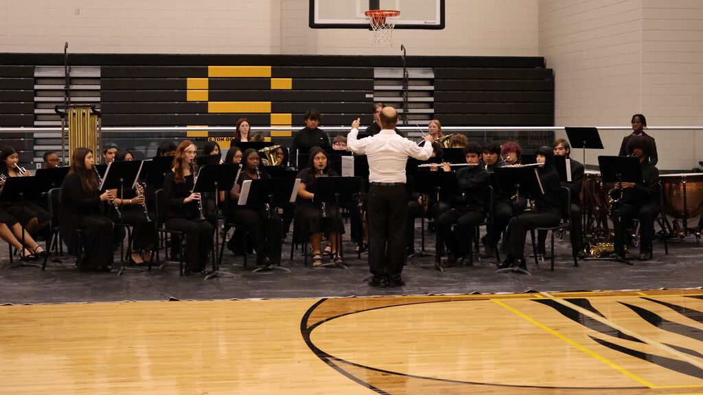 Image showing 🎶 What songs are playing in the background as you make memories this summer? 🎸  For this #FlashbackFriday, we are throwing it back to the beautiful music and incredible creativity of our Band and Chorus performances!  It takes a lot of practice, courage, and dedication to perform, and our students absolutely blew us away with their talents throughout the year.  🎶  #FlashbackFriday #FineArts #TigerBand #TigerChorus #SummerPlaylists 