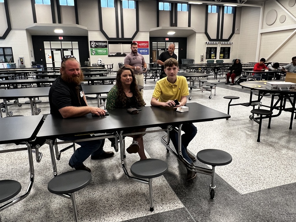 Image showing 💍✨ A BIG DAY FOR THE CLASS OF 2028! 🐅🖤💛  On Wednesday, August 27th, our Class of 2028 marked a major high school milestone as they officially received their class rings!  Representatives from The Roderick Group (an affiliate of Herff Jones) stopped by to deliver these timeless symbols of achievement—along with some delicious Chick-fil-A! 🐔🥤 They spent time sharing the rich history of class rings and guiding students on the tradition of how to wear them properly.  CHS Principal Mr. Rowe officially presented our Tigers with their rings, and then it was time to put them on display! 💎📸  Wearing their school pride on their hands, our juniors are moving forward together with one purpose—building memories that will last a lifetime under One Roar! ⚡  Once a Tiger, always a Tiger! 🐅🐾  #OneRoar #ClaxtonTigers #ClassOf2028 #HerffJones #ClassRings #TigerPride #OnceATigerAlwaysATiger #ClaxtonGA #CHSTigers