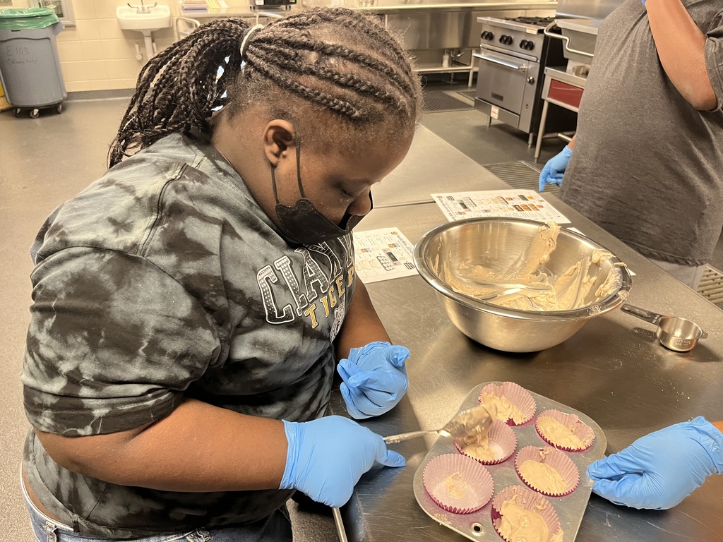 Image showing 🧁 BAKING UP SUCCESS IN DR. ROBINSON’S CLASS! 🐅🖤💛 Students in Dr. Robinson’s class have been busy building essential life and social skills through a tasty hands-on project! 👩🍳👨🍳 Our Tigers practiced reading and following a recipe step-by-step as they worked together to mix and bake homemade muffins. 🥣✨ Along the way, they put key communication skills into action by sharing materials, taking turns, and supporting one another as a team. And the best part? Enjoying the delicious results of their hard work! 😋🧁 Learning together, communicating together, and growing together with one shared purpose under One Roar! ⚡ Once a Tiger, always a Tiger! 🐅🐾 #OneRoar #ClaxtonTigers #LifeSkills #HandsOnLearning #TigerPride #OnceATigerAlwaysATiger #ClaxtonGA #CHSTigers