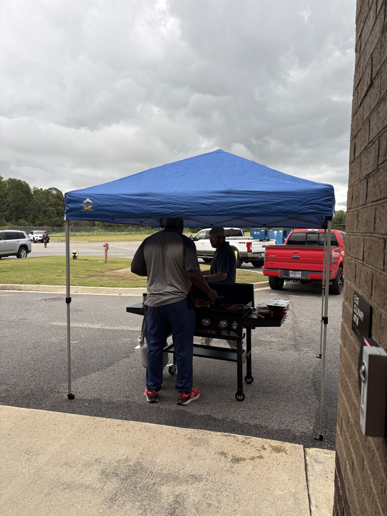 Image showing 🏈🍔 FOOD, FUN, AND SCHOOL SPIRIT! 🎉🐅🖤💛 On Friday, September 11, 2026, CHS was thrilled to host the first annual Evans County Schools Employees' Tailgate! It was an incredible evening of delicious food, fun, and connecting with colleagues before heading over to cheer on our Tigers at the game! 🎈🔥 A huge Special Thanks to The Claxton Bank for their generous donation of festive red, white, and blue treats that kept the party going! 🔴⚪🔵🎂 We want to send a heartfelt thank you to all of the Evans County Schools faculty, staff, and organizers who participated and helped make this inaugural event such a memorable success. Our school system is strongest when we come together as one family! 🤝⚡ Building community, celebrating our team, and moving with one shared purpose under One Roar! 🐅🖤💛 Once a Tiger, always a Tiger! 🐅🐾 #OneRoar #ClaxtonTigers #EvansCountySchools #TigerFamily #CommunityFirst #TheClaxtonBank #TigerPride #OnceATigerAlwaysATiger #ClaxtonGA #CHSTigers