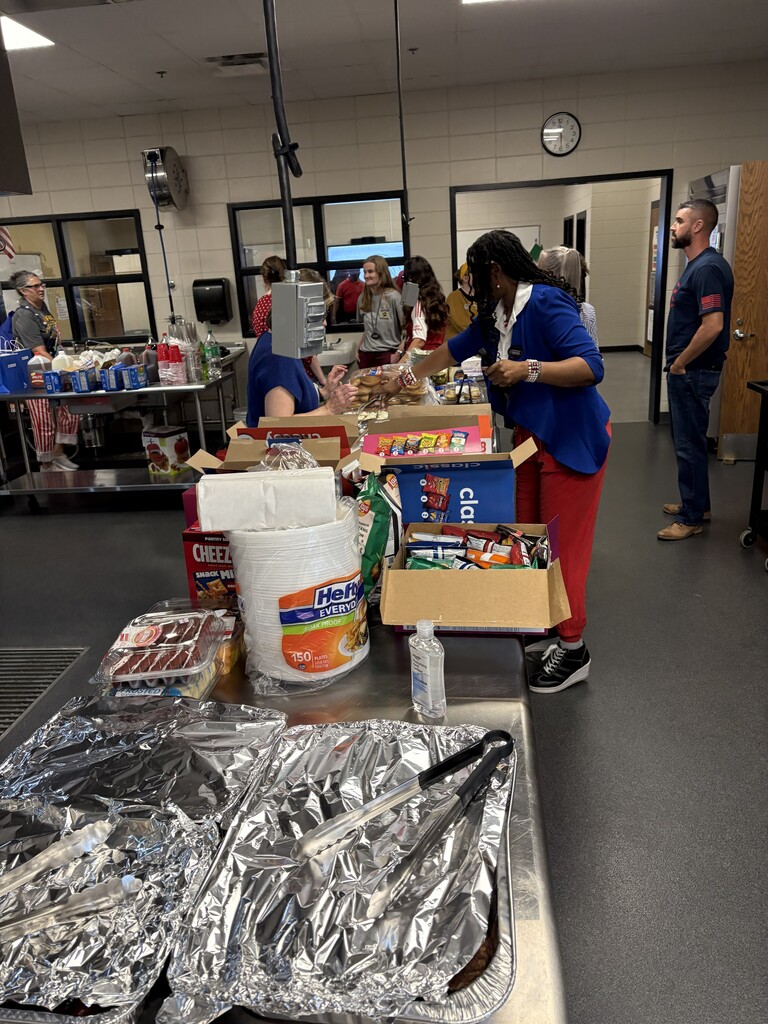 Image showing 🏈🍔 FOOD, FUN, AND SCHOOL SPIRIT! 🎉🐅🖤💛 On Friday, September 11, 2026, CHS was thrilled to host the first annual Evans County Schools Employees' Tailgate! It was an incredible evening of delicious food, fun, and connecting with colleagues before heading over to cheer on our Tigers at the game! 🎈🔥 A huge Special Thanks to The Claxton Bank for their generous donation of festive red, white, and blue treats that kept the party going! 🔴⚪🔵🎂 We want to send a heartfelt thank you to all of the Evans County Schools faculty, staff, and organizers who participated and helped make this inaugural event such a memorable success. Our school system is strongest when we come together as one family! 🤝⚡ Building community, celebrating our team, and moving with one shared purpose under One Roar! 🐅🖤💛 Once a Tiger, always a Tiger! 🐅🐾 #OneRoar #ClaxtonTigers #EvansCountySchools #TigerFamily #CommunityFirst #TheClaxtonBank #TigerPride #OnceATigerAlwaysATiger #ClaxtonGA #CHSTigers