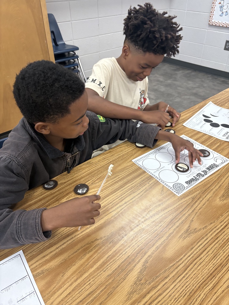 Students learning moon phases