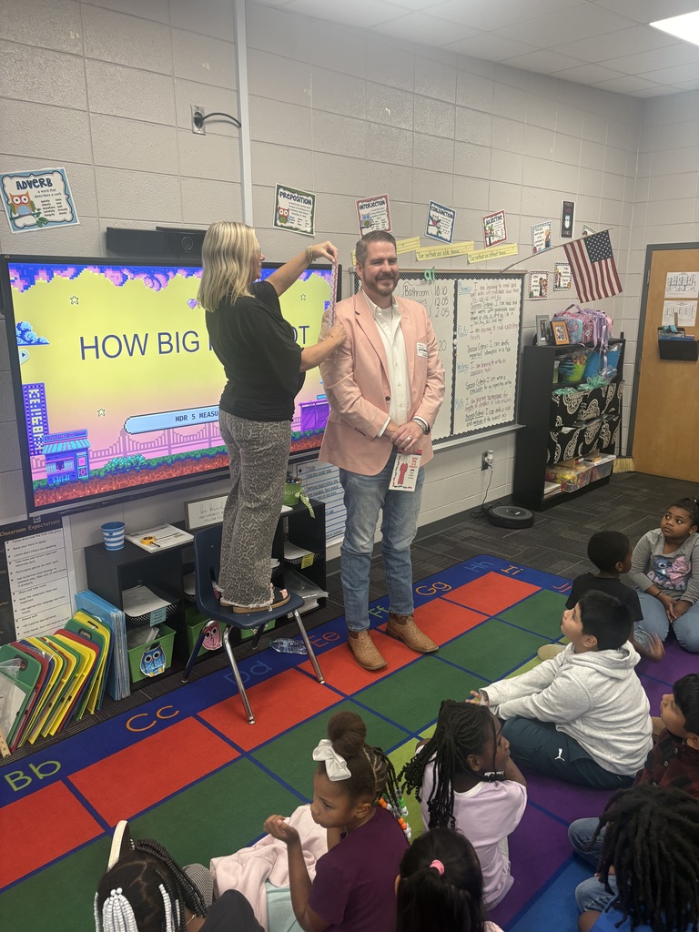 📏🐯 Measurement is getting REAL in 2nd grade! 🐯📏 Our second graders have been having a blast learning all about measurement! They’ve made their own rulers and put them to the test by measuring EVERYTHING from gummy worms—stretched and unstretched—to people! 😂📐 We were also lucky to have a very special guest reader, Mr. Paul Phillips, aka “Tall Paul,” join us to read How Big Is a Foot? 📚 He was the perfect person to help us put our measuring skills to work! After measuring Tall Paul, students measured themselves and then used their measurements to try to design and build a bed that would actually fit them! 🛏️📏 What a fun way to turn math into a hands-on learning experience! Way to go, 2nd grade! 💛🖤 #ClaxtonTigers #CESProud #SecondGrade #Measurement #HandsOnLearning #MathIsFun #PardonOurProgress #SuccessUnderConstruction