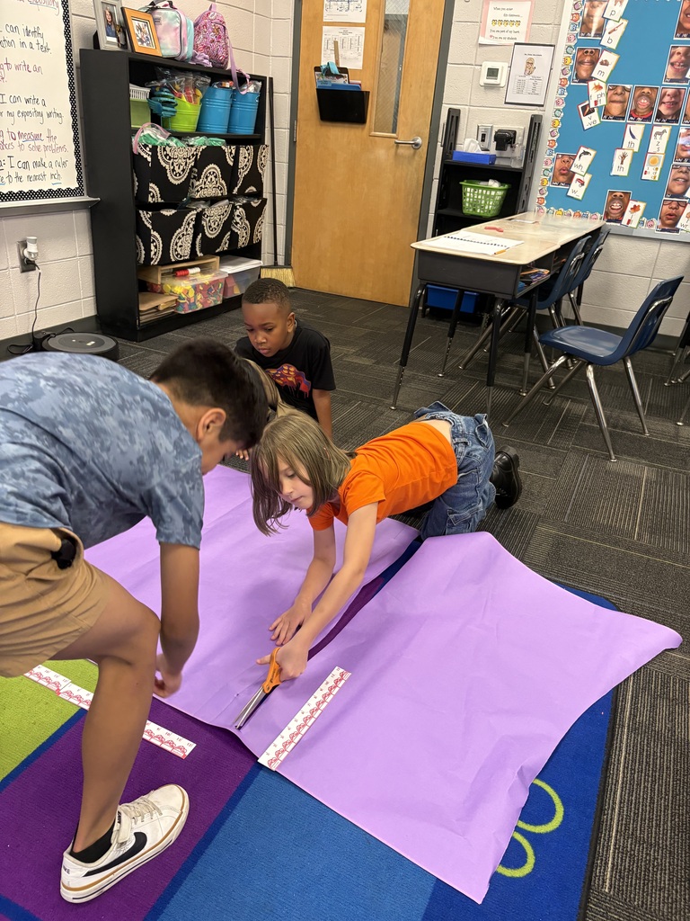 📏🐯 Measurement is getting REAL in 2nd grade! 🐯📏 Our second graders have been having a blast learning all about measurement! They’ve made their own rulers and put them to the test by measuring EVERYTHING from gummy worms—stretched and unstretched—to people! 😂📐 We were also lucky to have a very special guest reader, Mr. Paul Phillips, aka “Tall Paul,” join us to read How Big Is a Foot? 📚 He was the perfect person to help us put our measuring skills to work! After measuring Tall Paul, students measured themselves and then used their measurements to try to design and build a bed that would actually fit them! 🛏️📏 What a fun way to turn math into a hands-on learning experience! Way to go, 2nd grade! 💛🖤 #ClaxtonTigers #CESProud #SecondGrade #Measurement #HandsOnLearning #MathIsFun #PardonOurProgress #SuccessUnderConstruction
