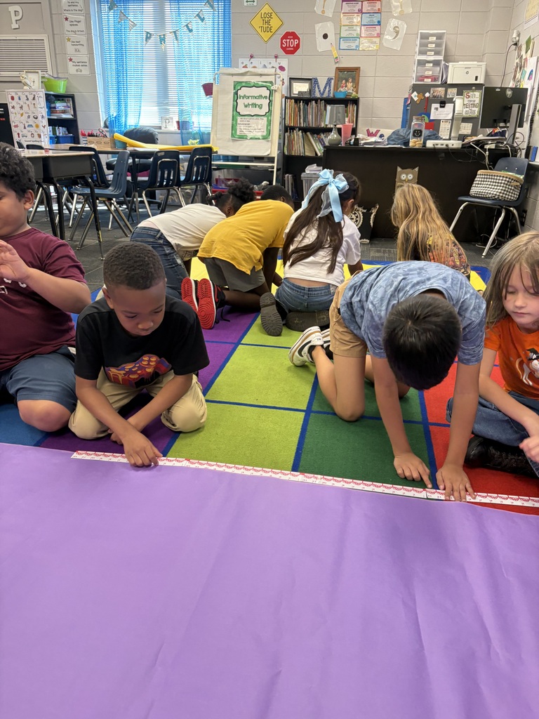 📏🐯 Measurement is getting REAL in 2nd grade! 🐯📏 Our second graders have been having a blast learning all about measurement! They’ve made their own rulers and put them to the test by measuring EVERYTHING from gummy worms—stretched and unstretched—to people! 😂📐 We were also lucky to have a very special guest reader, Mr. Paul Phillips, aka “Tall Paul,” join us to read How Big Is a Foot? 📚 He was the perfect person to help us put our measuring skills to work! After measuring Tall Paul, students measured themselves and then used their measurements to try to design and build a bed that would actually fit them! 🛏️📏 What a fun way to turn math into a hands-on learning experience! Way to go, 2nd grade! 💛🖤 #ClaxtonTigers #CESProud #SecondGrade #Measurement #HandsOnLearning #MathIsFun #PardonOurProgress #SuccessUnderConstruction