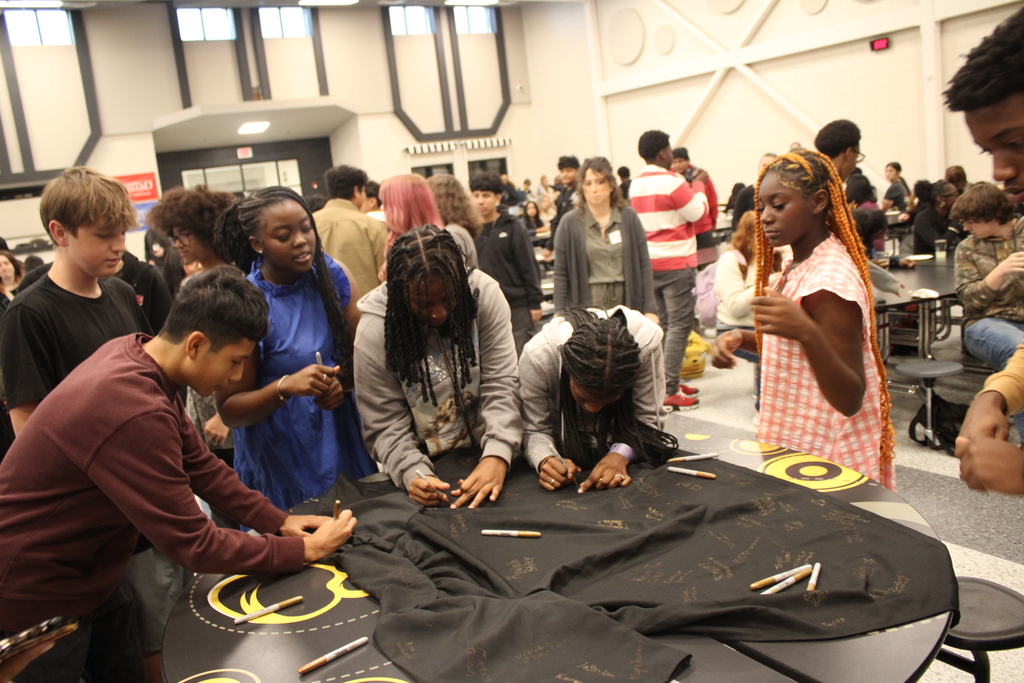 Image showing 🎓✨ CHS FRESHMEN COMMIT TO GRADUATING! CLASS OF 2030 TAKES THE PLEDGE! 🖤💛🐅  On Friday, October 2, 2026, our Claxton High School 9th graders took a monumental step in their high school journey during the annual 9th Grade Commitment Ceremony! Surrounded by families, faculty, and supporters, the Class of 2030 officially pledged to put in the work required to cross the stage and graduate on time in May 2030! 📜🎓  The morning opened with a warm welcome from CHS Principal James Rowe, followed by CHS Counselor Pamela Calloway introducing guest speaker and CHS alumnus Robbie Lane (Class of 2022)! 🎙️🌟  Robbie delivered an inspiring message, sharing 5 key points for achieving success in school and in life: 1️⃣ Set goals and chase goals 🎯 2️⃣ Be a great friend and make great friends 🤝 3️⃣ Build a strong work ethic 💪 4️⃣ Never let anyone tell you that you can't 🚫🛑 5️⃣ Find your purpose ✨  To seal their commitment, students signed a graduation gown, enjoyed refreshments with their families, and took a full class photo to mark this special milestone! 📸🥳  We are so proud of our Class of 2030 and can’t wait to support them every step of the way as they strive with one shared purpose under One Roar! ⚡  Once a Tiger, always a Tiger! 🐅🐾  #OneRoar #ClaxtonTigers #ClassOf2030 #CommitmentCeremony #GraduationBound #FreshmanYear #TigerPride #OnceATigerAlwaysATiger #ClaxtonGA #CHSTigers
