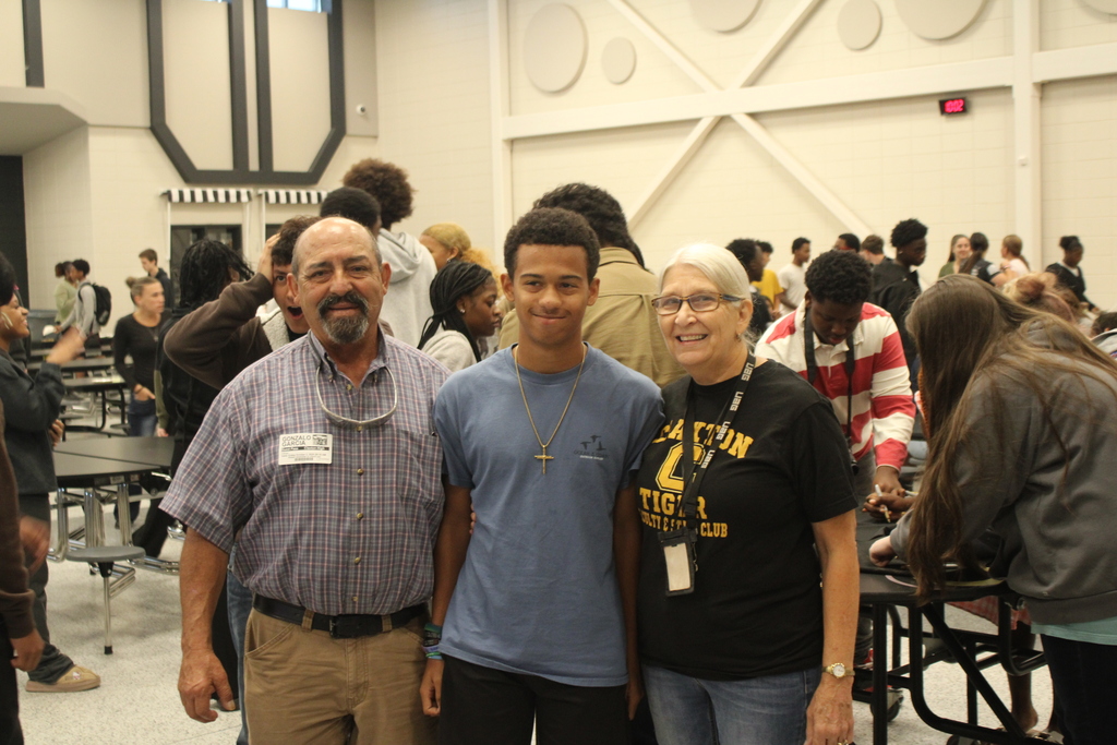 Image showing 🎓✨ CHS FRESHMEN COMMIT TO GRADUATING! CLASS OF 2030 TAKES THE PLEDGE! 🖤💛🐅  On Friday, October 2, 2026, our Claxton High School 9th graders took a monumental step in their high school journey during the annual 9th Grade Commitment Ceremony! Surrounded by families, faculty, and supporters, the Class of 2030 officially pledged to put in the work required to cross the stage and graduate on time in May 2030! 📜🎓  The morning opened with a warm welcome from CHS Principal James Rowe, followed by CHS Counselor Pamela Calloway introducing guest speaker and CHS alumnus Robbie Lane (Class of 2022)! 🎙️🌟  Robbie delivered an inspiring message, sharing 5 key points for achieving success in school and in life: 1️⃣ Set goals and chase goals 🎯 2️⃣ Be a great friend and make great friends 🤝 3️⃣ Build a strong work ethic 💪 4️⃣ Never let anyone tell you that you can't 🚫🛑 5️⃣ Find your purpose ✨  To seal their commitment, students signed a graduation gown, enjoyed refreshments with their families, and took a full class photo to mark this special milestone! 📸🥳  We are so proud of our Class of 2030 and can’t wait to support them every step of the way as they strive with one shared purpose under One Roar! ⚡  Once a Tiger, always a Tiger! 🐅🐾  #OneRoar #ClaxtonTigers #ClassOf2030 #CommitmentCeremony #GraduationBound #FreshmanYear #TigerPride #OnceATigerAlwaysATiger #ClaxtonGA #CHSTigers