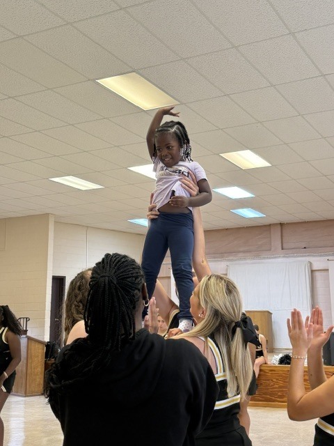 Image showing 📣📣 SPREADING HOMECOMING SPIRIT TO OUR LITTLEST TIGERS! 📣🐅🖤💛 On Tuesday, October 6, 2026, our amazing CHS Cheerleaders brought the energy, smiles, and Tiger Pride to Evans County Headstart for a special Homecoming Pep Rally! 🎉✨ Our cheer team helped the Headstart children get pumped up for Homecoming Week, teaching them cheers, showing off some moves, and making sure our future Tigers felt right in the middle of the celebration! 📣🐾 Building community, sharing joy, and inspiring the next generation as we roar together with one shared purpose under One Roar! ⚡ Once a Tiger, always a Tiger! 🐅🐾 #OneRoar #ClaxtonTigers #CHSHomecoming #Homecoming2026 #CHSCheer #FutureTigers #EvansCountyHeadstart #TigerPride #OnceATigerAlwaysATiger #ClaxtonGA #CHSTigers