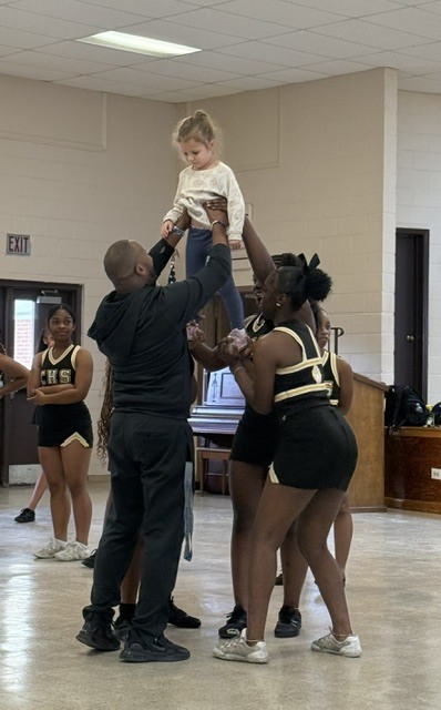 Image showing 📣📣 SPREADING HOMECOMING SPIRIT TO OUR LITTLEST TIGERS! 📣🐅🖤💛 On Tuesday, October 6, 2026, our amazing CHS Cheerleaders brought the energy, smiles, and Tiger Pride to Evans County Headstart for a special Homecoming Pep Rally! 🎉✨ Our cheer team helped the Headstart children get pumped up for Homecoming Week, teaching them cheers, showing off some moves, and making sure our future Tigers felt right in the middle of the celebration! 📣🐾 Building community, sharing joy, and inspiring the next generation as we roar together with one shared purpose under One Roar! ⚡ Once a Tiger, always a Tiger! 🐅🐾 #OneRoar #ClaxtonTigers #CHSHomecoming #Homecoming2026 #CHSCheer #FutureTigers #EvansCountyHeadstart #TigerPride #OnceATigerAlwaysATiger #ClaxtonGA #CHSTigers