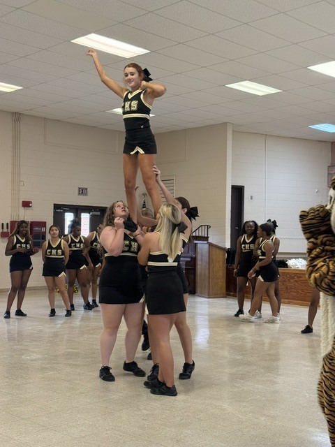 Image showing 📣📣 SPREADING HOMECOMING SPIRIT TO OUR LITTLEST TIGERS! 📣🐅🖤💛 On Tuesday, October 6, 2026, our amazing CHS Cheerleaders brought the energy, smiles, and Tiger Pride to Evans County Headstart for a special Homecoming Pep Rally! 🎉✨ Our cheer team helped the Headstart children get pumped up for Homecoming Week, teaching them cheers, showing off some moves, and making sure our future Tigers felt right in the middle of the celebration! 📣🐾 Building community, sharing joy, and inspiring the next generation as we roar together with one shared purpose under One Roar! ⚡ Once a Tiger, always a Tiger! 🐅🐾 #OneRoar #ClaxtonTigers #CHSHomecoming #Homecoming2026 #CHSCheer #FutureTigers #EvansCountyHeadstart #TigerPride #OnceATigerAlwaysATiger #ClaxtonGA #CHSTigers