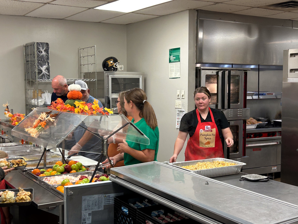 Thanksgiving Lunch, board members and admins serve lunch image