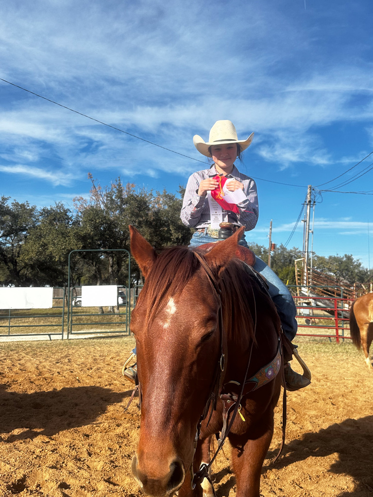 Isela R. Horse entry and ribbons