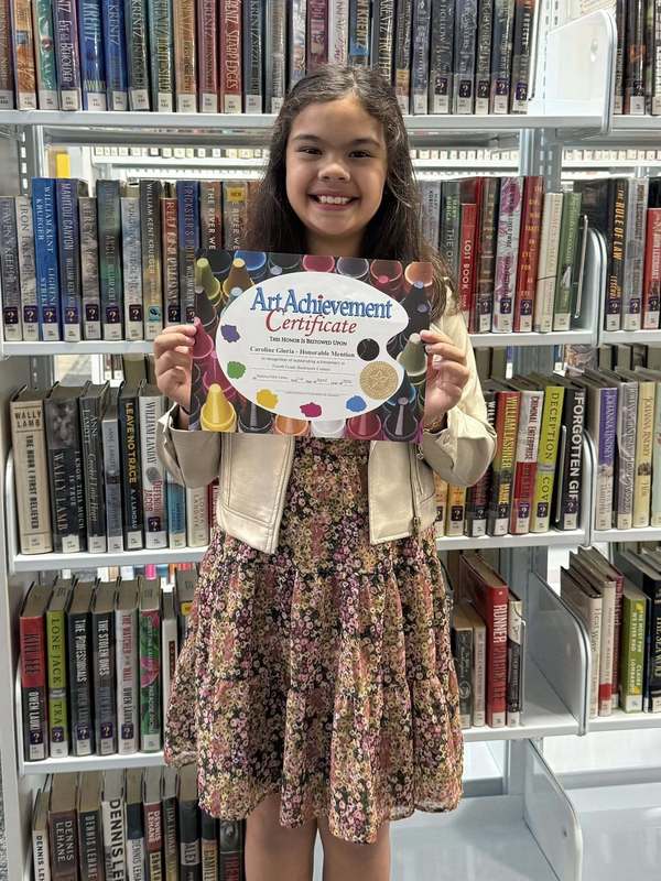 Caroline with certificate, image