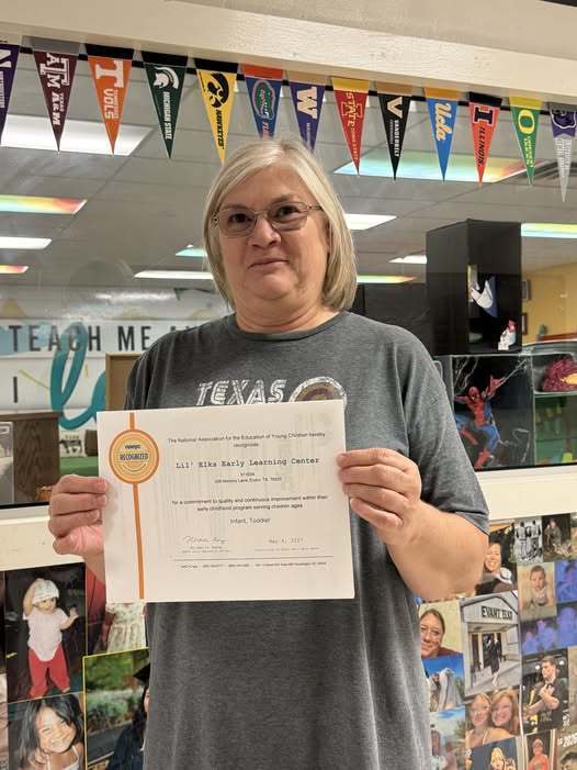 Sandra Doyle, Lil' Elks Early Learning Center Director and  certificate  of recognition, image