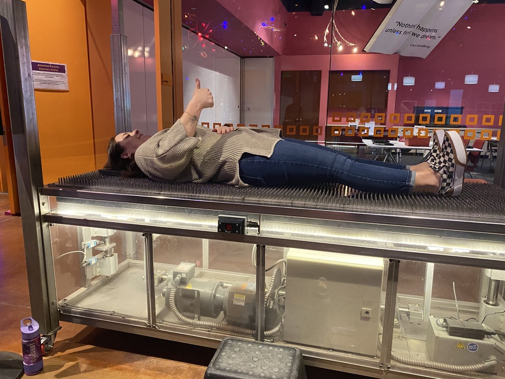 Teacher on bed of nails