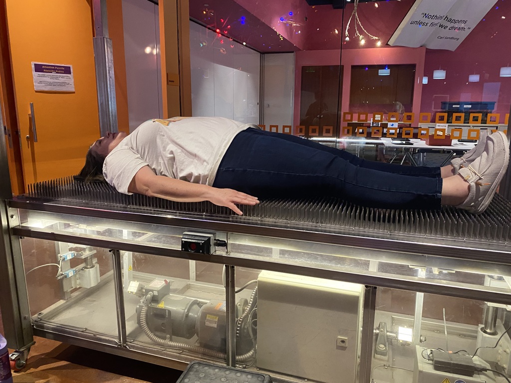Teacher on bed of nails