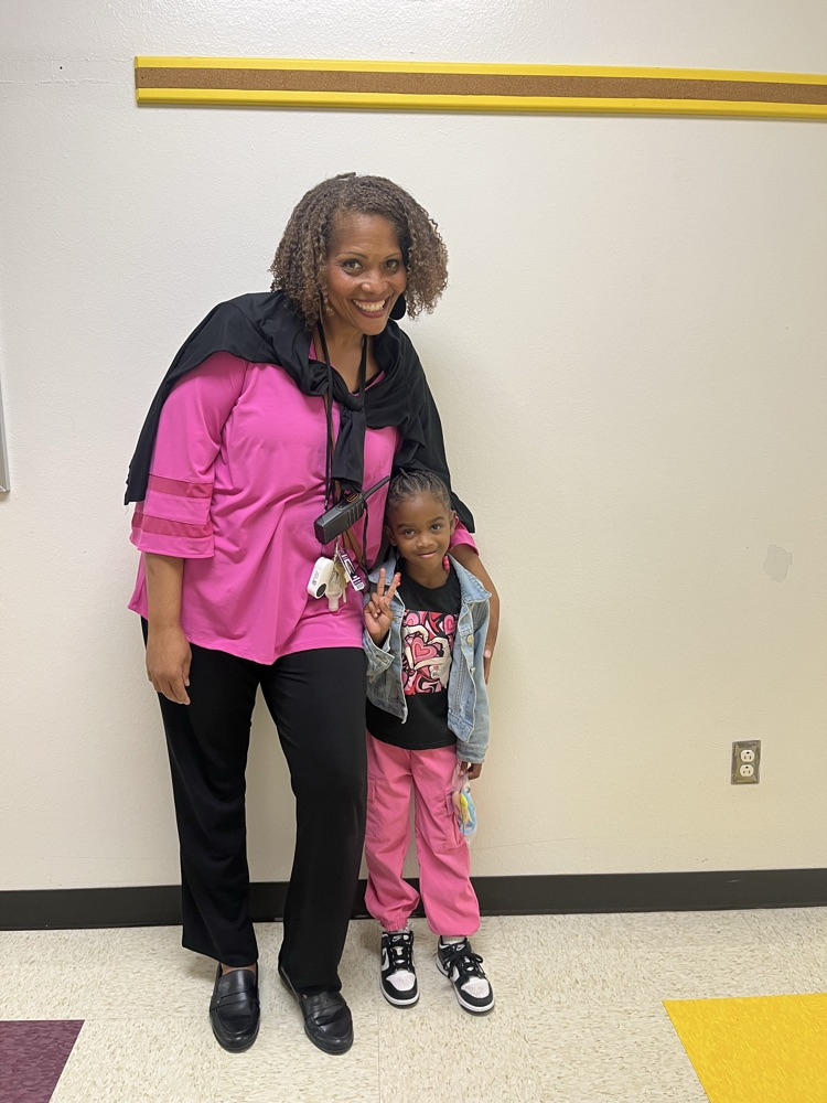 Assistant Principal and student in matching outfits for homecoming spirit days