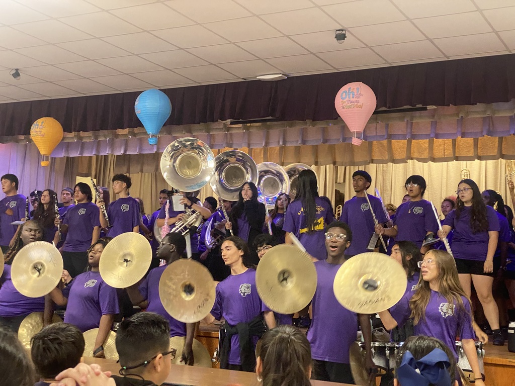 Band members playing a song.