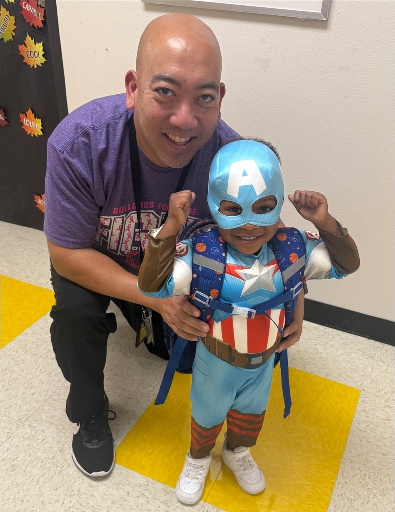 Mr. utsumi posing with student dressed as Captain America