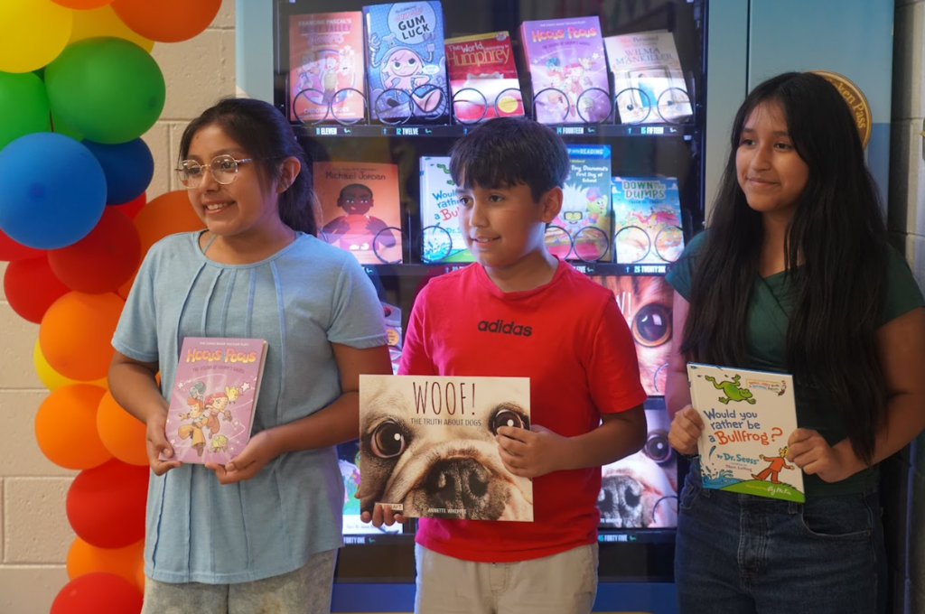 Students in front of book vending machine