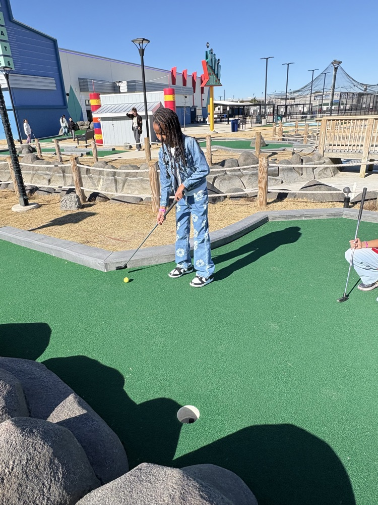 Students playing miniature golf