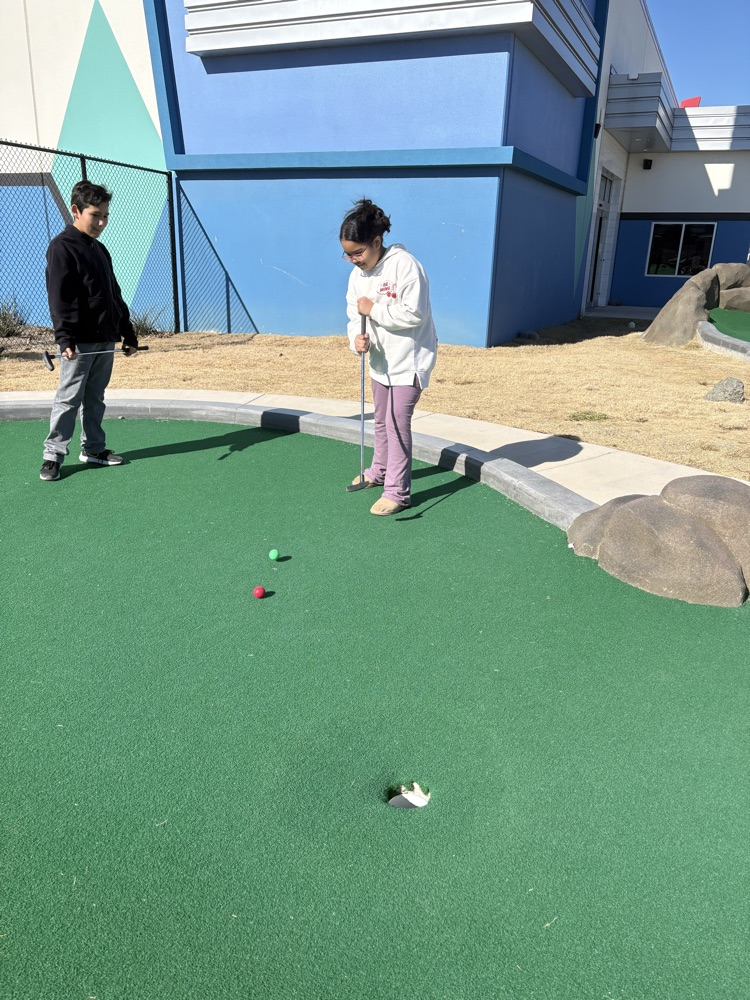 Students playing miniature golf